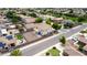 Aerial view of a residential neighborhood, showcasing well-kept homes, desert landscaping, and solar panels on several roofs at 1036 E Magnum Rd, San Tan Valley, AZ 85140