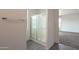 Walk-in shower features glass doors, tile floors, and access to the bedroom at 1036 E Magnum Rd, San Tan Valley, AZ 85140
