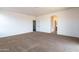 Spacious bedroom offers neutral carpet, ample light, and access to the bathroom at 1036 E Magnum Rd, San Tan Valley, AZ 85140