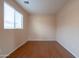 Cozy bedroom with natural light from the window and light peach painted walls at 1036 E Magnum Rd, San Tan Valley, AZ 85140