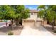 This home boasts a stucco exterior, mature trees, and a well-manicured yard with a three-car garage at 1036 E Magnum Rd, San Tan Valley, AZ 85140