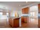 Spacious kitchen features an island, plenty of cabinet space, and wood-look floors at 1036 E Magnum Rd, San Tan Valley, AZ 85140