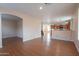 Spacious living room area with wood look floors leading to the kitchen at 1036 E Magnum Rd, San Tan Valley, AZ 85140