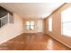 Bright and airy living space featuring hard surface flooring and staircase to the second floor at 1036 E Magnum Rd, San Tan Valley, AZ 85140