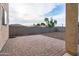This covered patio has an upgraded brick surface and has great views of the low-maintenance backyard at 1036 E Magnum Rd, San Tan Valley, AZ 85140