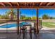 Backyard with pool view from patio seating area at 1170 E Carmen St, Tempe, AZ 85283