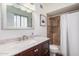Bathroom with a marble vanity, white sink, a shower with marble tile, and a white shower curtain at 1170 E Carmen St, Tempe, AZ 85283