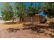 Well-maintained brick home with an arched entryway and lush landscaping, offering privacy and style at 1170 E Carmen St, Tempe, AZ 85283
