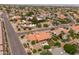 Expansive aerial view of a desert neighborhood with tile roofs and mature landscaping at 12899 W Pasadena Ave, Litchfield Park, AZ 85340