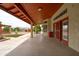 Covered back patio featuring an outdoor space with a view to the backyard with fountain at 12899 W Pasadena Ave, Litchfield Park, AZ 85340