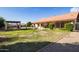 Expansive backyard features a covered patio, gazebo, water feature and desert landscaping at 12899 W Pasadena Ave, Litchfield Park, AZ 85340