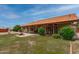 Expansive backyard features a patio, a gazebo, lush greenery, and a tranquil fountain at 12899 W Pasadena Ave, Litchfield Park, AZ 85340