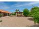Sprawling backyard with covered patio, offering a serene outdoor space for relaxation and entertainment at 12899 W Pasadena Ave, Litchfield Park, AZ 85340