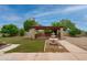Inviting backyard with a covered patio and fountain, offering a serene space for relaxation and outdoor enjoyment at 12899 W Pasadena Ave, Litchfield Park, AZ 85340