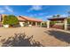 Backyard view of home featuring a covered patio, gazebo, fountain and desert landscaping at 12899 W Pasadena Ave, Litchfield Park, AZ 85340