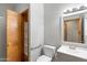 Well-lit bathroom features tiled shower, modern vanity with new faucet fixtures and mirror at 12899 W Pasadena Ave, Litchfield Park, AZ 85340