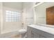 Well-lit bathroom with a tub and shower combination, and updated vanity at 12899 W Pasadena Ave, Litchfield Park, AZ 85340