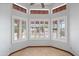 Charming breakfast nook area featuring a bay window with white shutters at 12899 W Pasadena Ave, Litchfield Park, AZ 85340