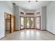 Large bedroom featuring access to the back yard via french doors at 12899 W Pasadena Ave, Litchfield Park, AZ 85340