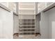 Spacious closet with white built-in shelving, providing ample storage space for clothing and accessories at 12899 W Pasadena Ave, Litchfield Park, AZ 85340