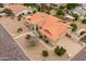 Aerial view of a single story home with a terracotta roof and well-manicured landscaping at 12899 W Pasadena Ave, Litchfield Park, AZ 85340