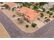 An aerial shot showcases a single story home with well kept landscaping and a terracotta roof at 12899 W Pasadena Ave, Litchfield Park, AZ 85340