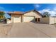 Charming home with a tile roof, three garage doors and extended driveway at 12899 W Pasadena Ave, Litchfield Park, AZ 85340