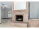 Close up of brick fireplace with decorative rock feature in large open living area at 12899 W Pasadena Ave, Litchfield Park, AZ 85340