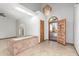 Bright foyer featuring tile flooring, unique brick features, chandelier, and lots of natural light at 12899 W Pasadena Ave, Litchfield Park, AZ 85340