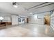 Bright and spacious garage with plenty of built-in cabinets and storage areas at 12899 W Pasadena Ave, Litchfield Park, AZ 85340