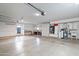 Spacious garage with built-in cabinets, work area, and ample storage space at 12899 W Pasadena Ave, Litchfield Park, AZ 85340