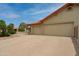 Large two car garage with a spacious driveway and clean, desert landscaping at 12899 W Pasadena Ave, Litchfield Park, AZ 85340