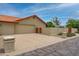 Large two car garage with a spacious driveway and clean, desert landscaping at 12899 W Pasadena Ave, Litchfield Park, AZ 85340