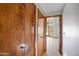 Hallway with tile floors leading to a room with lots of natural light at 12899 W Pasadena Ave, Litchfield Park, AZ 85340