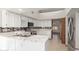 Well-lit kitchen with stainless steel appliances and sleek countertops at 12899 W Pasadena Ave, Litchfield Park, AZ 85340