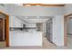 Modern kitchen featuring white cabinets, stainless steel appliances, and marble countertops at 12899 W Pasadena Ave, Litchfield Park, AZ 85340