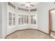 Bright sitting room featuring plantation shutters for natural light control and privacy at 12899 W Pasadena Ave, Litchfield Park, AZ 85340