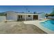 Bright backyard with a pristine in-ground pool and a covered patio that is perfect for entertaining guests at 1423 W Joan De Arc Ave, Phoenix, AZ 85029