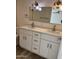 Bathroom featuring a new double sink vanity with white cabinets and marble countertop, plus updated fixtures at 1423 W Joan De Arc Ave, Phoenix, AZ 85029