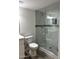 Bathroom featuring a new glass shower enclosure with marble tiling, plus updated fixtures at 1423 W Joan De Arc Ave, Phoenix, AZ 85029
