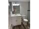 Bright bathroom featuring a new vanity with white cabinets and a marble countertop, with updated fixtures at 1423 W Joan De Arc Ave, Phoenix, AZ 85029