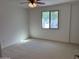Inviting bedroom with a ceiling fan and a window that overlooks greenery, providing a serene retreat at 1423 W Joan De Arc Ave, Phoenix, AZ 85029