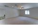 Inviting bedroom with plush carpet, ceiling fan, and a window offering natural light at 1423 W Joan De Arc Ave, Phoenix, AZ 85029