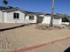 Charming single-story home with a xeriscaped front yard and attached two car garage at 1423 W Joan De Arc Ave, Phoenix, AZ 85029