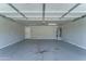 Empty garage featuring a water heater and plenty of space at 1423 W Joan De Arc Ave, Phoenix, AZ 85029