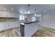 Stylish kitchen with white cabinetry, stainless steel appliances, and a center island with breakfast bar at 1423 W Joan De Arc Ave, Phoenix, AZ 85029