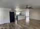 Open-concept living space showcasing kitchen with island, neutral paint, and wood-look floors at 1423 W Joan De Arc Ave, Phoenix, AZ 85029