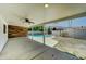 Spacious covered patio featuring wood accents, a ceiling fan and backyard views at 1423 W Joan De Arc Ave, Phoenix, AZ 85029