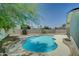 Inviting backyard pool surrounded by trees and landscaping at 1423 W Joan De Arc Ave, Phoenix, AZ 85029