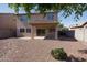 Large backyard featuring desert landscaping, covered patio, and ample space for outdoor activities at 14552 W Hearn Rd, Surprise, AZ 85379